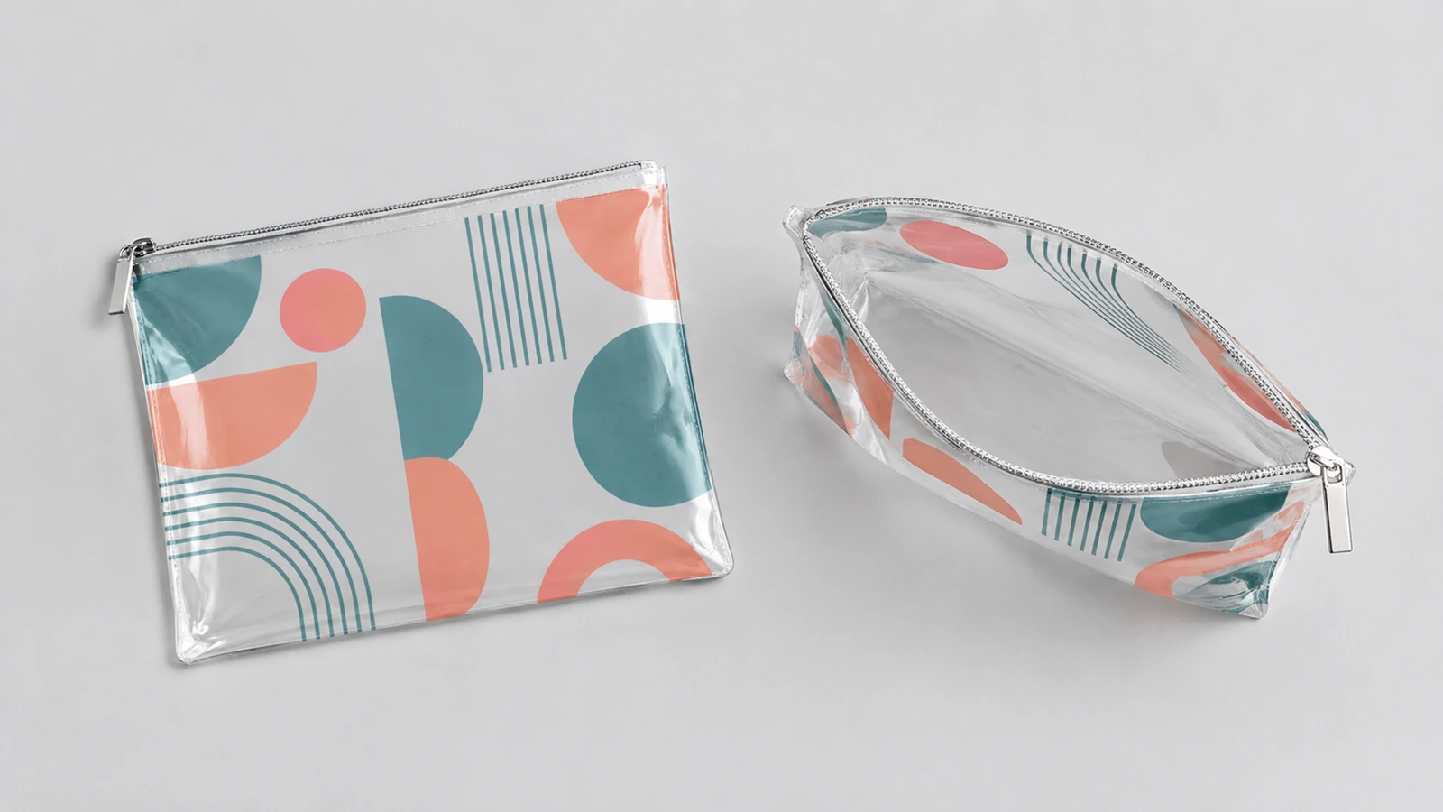 Kantong resleting bening tertutup dan terbuka dengan cetakan geometris warna koral dan teal